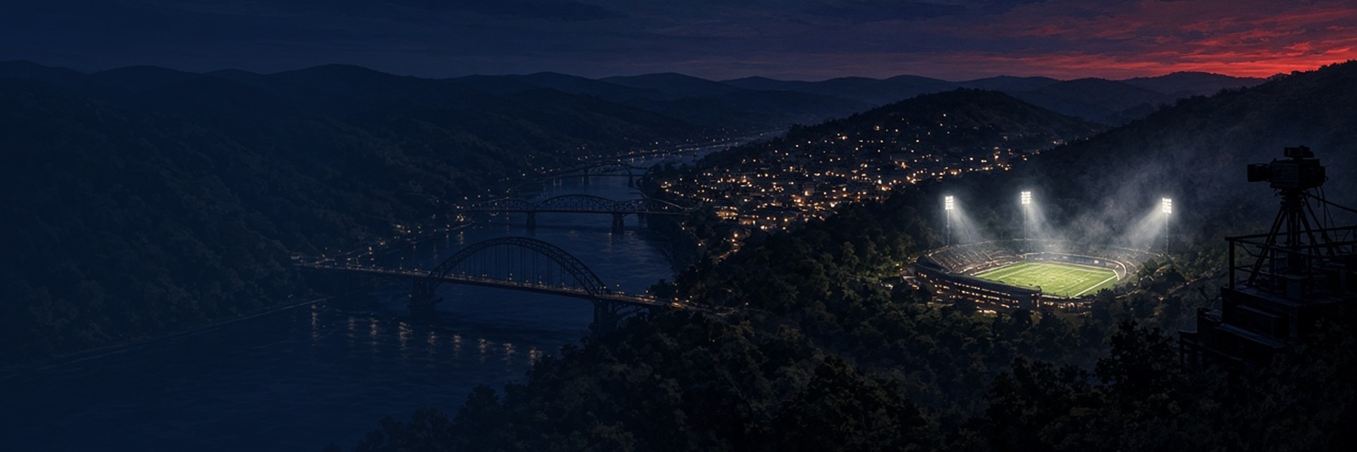 A night panorama of a Western Pennsylvania river valley, with lit arch bridges over a dark river, wooded hills, a hillside town and a floodlit high school stadium glowing in the valley, while a broadcast camera on a riser overlooks the scene under a navy sky with a red glow on the horizon. Illustration created with AI.